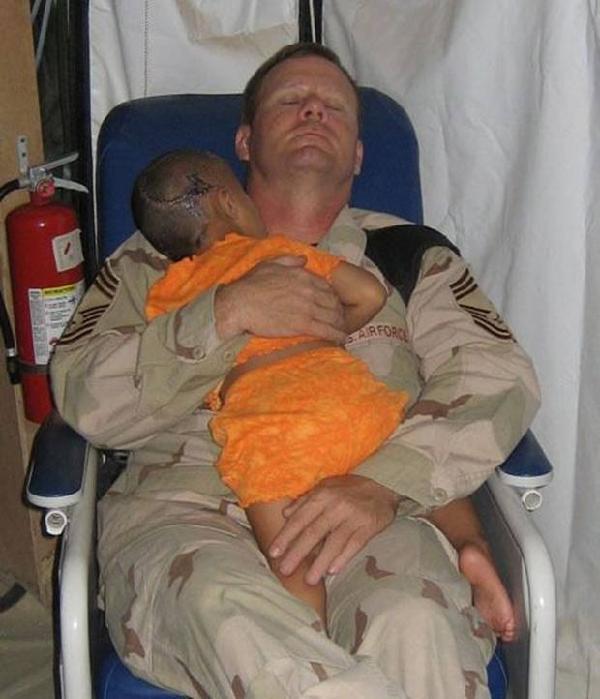 Soldier Sleeping Holding Iraqi Child