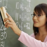 woman teaching at a blackboard