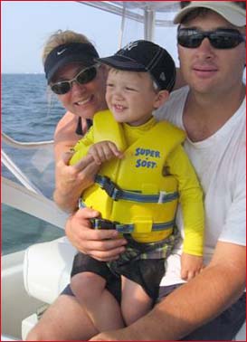 Cameron with his parents on a boat to see pop.