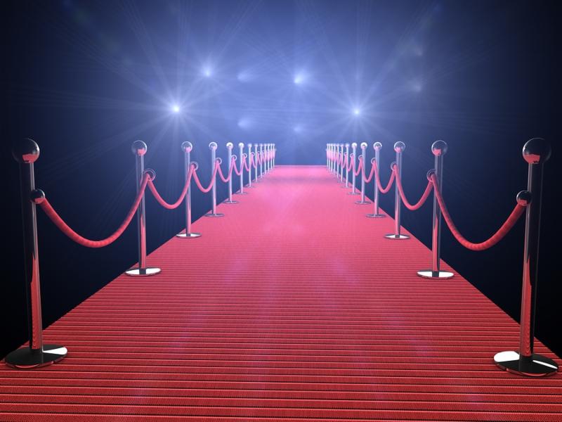 red carpet with flash lights in the background