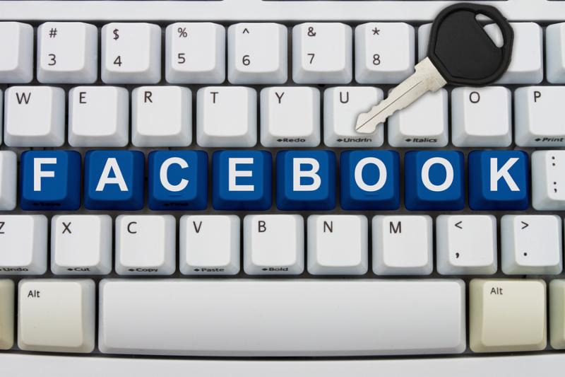 Computer keyboard keys with word Facebook and a key Protecting your Facebook information