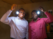 (L-R): Executive Director Chuka Eze and CEO Ifeanyi Orajaka, of Green Village Electricity Project (GVE) demonstrate how their innovative technologies can illuminate households and increase productivity in remote areas.