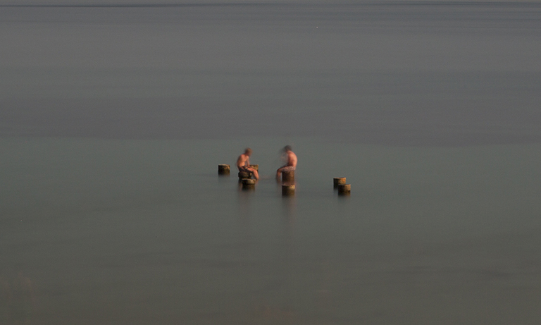 Two Boys on Pilings