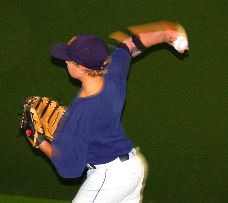 Nick Kafer wearing the ThrowMAX with Maximum Shoulder External rotation throwing a two seam fastball. The Arm blurs with acceleration as shoulders square to target.