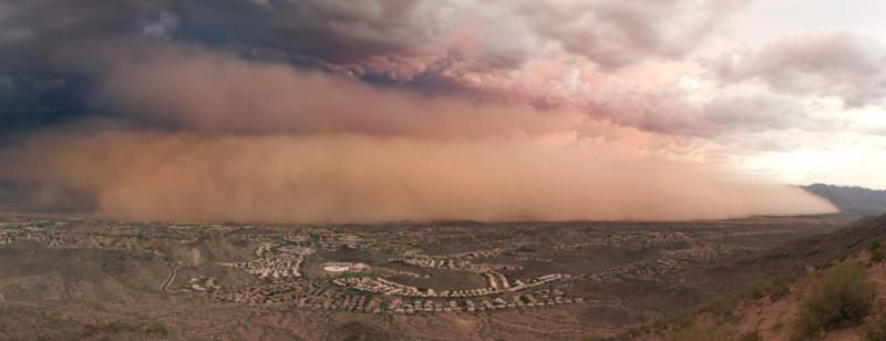 Desert dust storm blanketing Phoenix metro area.
