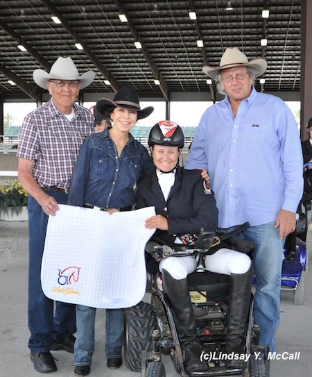 Lauren Barwick (CAN) Two -Time Paralympian, Grade II, at the Adequan Global Dressage Festival CPEDI3*. Barwick earned the high point award for Para-Dressage. Also pictured (Left to right) Newton Oldcrow, Jeanette Sassoon, and Gary Fellers of Polo Gear. Photo by Lindsay McCall.
