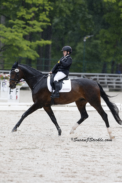 Sydney Collier (Grade Ib) and NTEC Cuplee (Warmblood), owned by Victoria Dugan. Photo copyright SusanJStickle.com. Photo is taken in Gladstone, NJ at the 2014 USEF Para-Equestrian Dressage National Championship/ Selection Trial for the Alltech FEI World Equestrian Games™ (WEG).