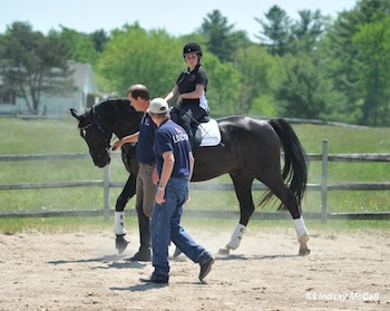 Coaches Kai Handt and Wes Dunham demonstrate working together with rider Sydney Collier and horse Wentworth