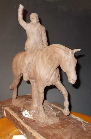 Trophy in a clay form.  The bronze trophy goes through phases of production before it reaches the final bronzed look.