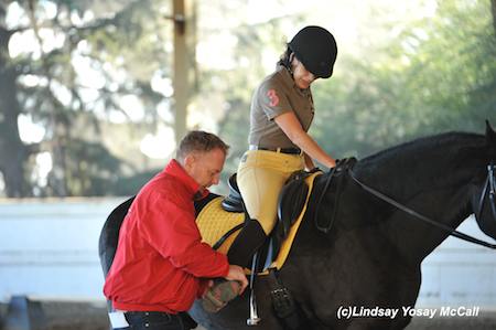 Dennis Callin talks with Emily Sheffield about aids she could use as a Para-Dressage rider. Photo by Lindsay Y McCall