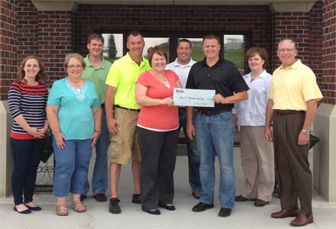 BaseÂ® presents Check to J.D.Gomke Charity